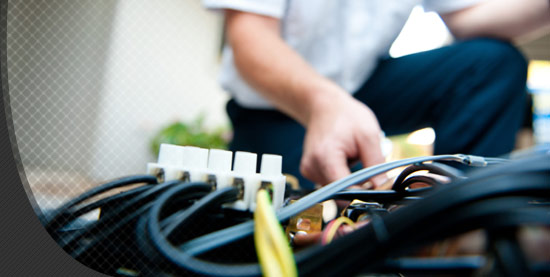 A man fixing wires in Lynchburg, WA.